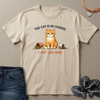 Beige t-shirt with a cat graphic and text on a beige background
