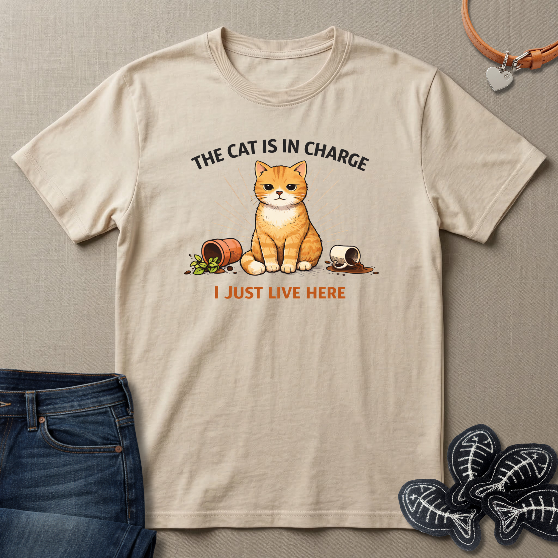 Beige t-shirt with a cat graphic and text on a beige background