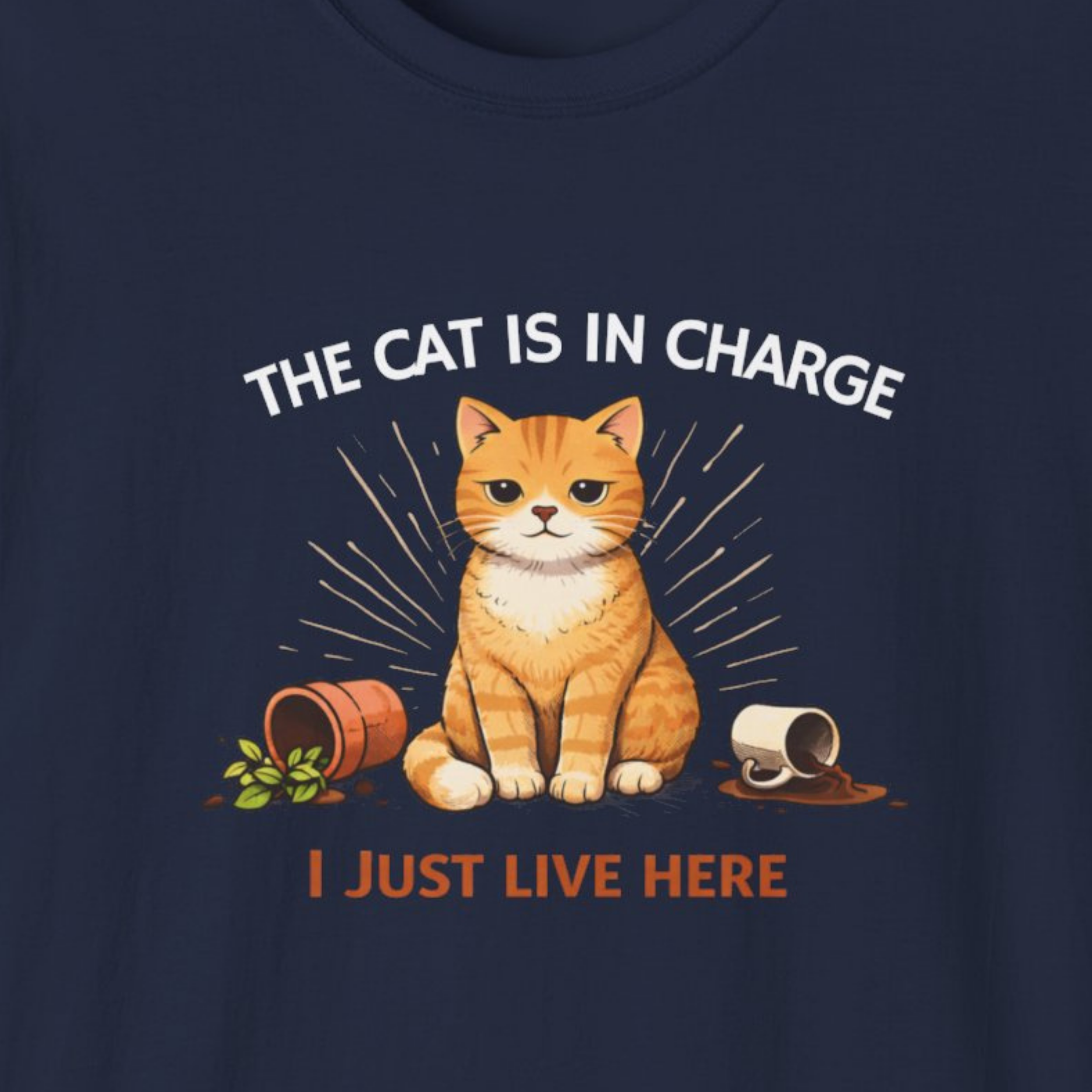 Navy blue t-shirt with a cat graphic and text 'The cat is in charge. I just live here.'