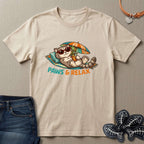 Beige t-shirt with a cat graphic and 'Paws & Relax' text on a beige background