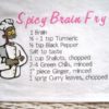 Zombie Chef's Spicy Brain Fry recipe on a large cotton dishtowel