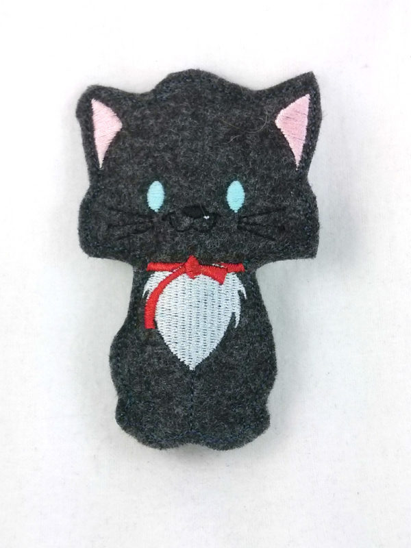 Belioz, boy kitten finger puppet with blue eyes that glow in the dark