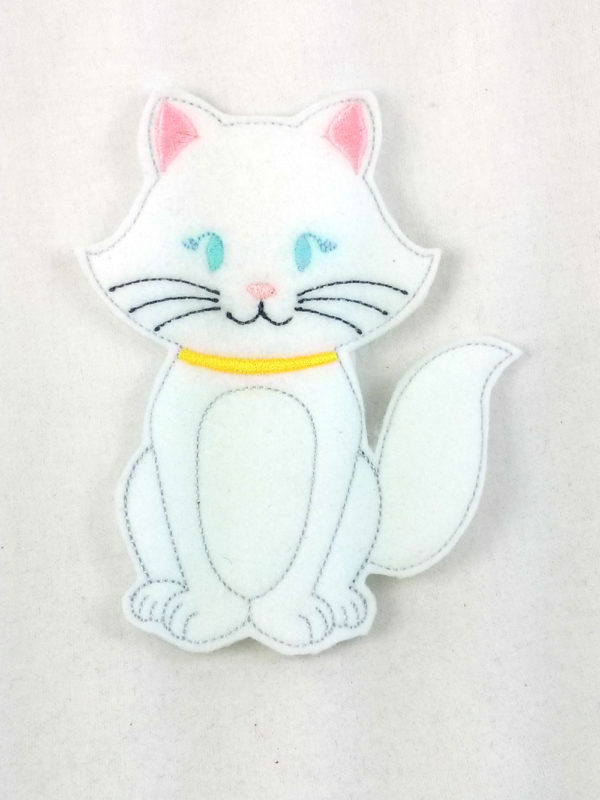 Duchess, momma cat finger puppet with blue eyes that glow in the dark
